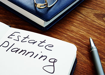 Estate planning handwriting sign on the sheet