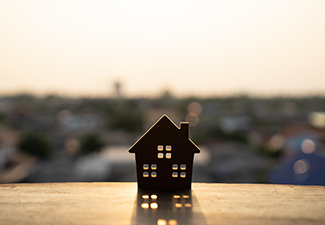 House model on wood table. 