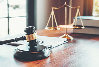 Scales, gavel, and legal books on a desk