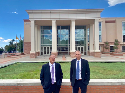 Attorneys Luke and David in front of the courthouse