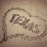 Heart Drawn in Sand with Caption "Texas"