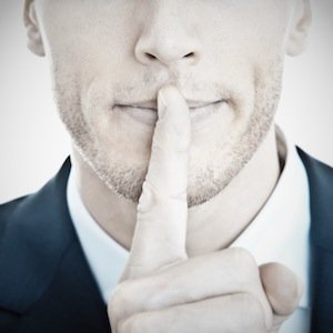 Man Holding His Finger in A Shushing Pose