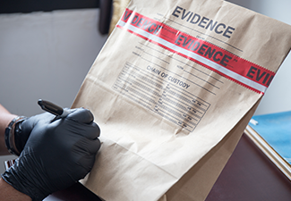 Hand in Glove Writing on Evidence Bag and Seal by Red Tape