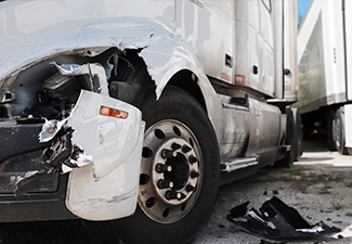 Damage closeup on white truck