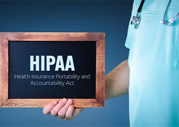 Doctor shows HIPAA sign board