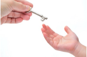 Adult Handing over Key to Child