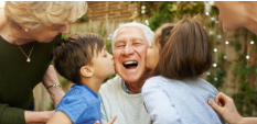 Kids Kissing Old Man on the Cheek