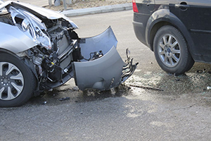 Car crash on road with broken bumper