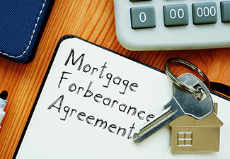 Mortgage Forbearance Agreement is shown on the conceptual business photo.