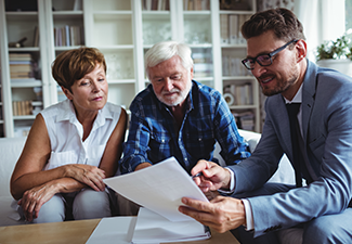 Senior couple estate planning with their financial advisor