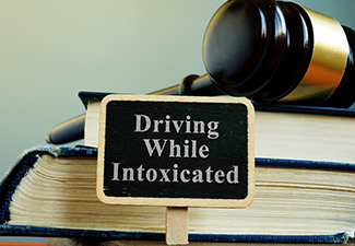 DWI driving while intoxicated law and books.