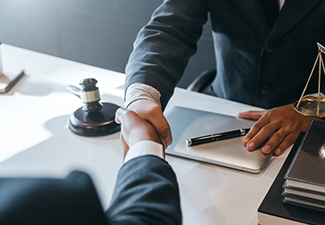 Businessman Shaking Hands with His Partner Lawyers or Attorneys