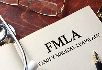 Page with FMLA family medical leave act on a table.