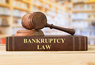 Bankruptcy Law Book with Gavel on Top 