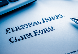 Personal injury claim form on desk.