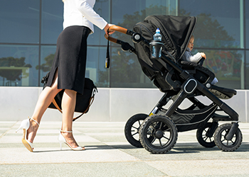 Business Woman Pushing Stroller