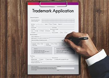 Man Filling Trademark Application Document Form