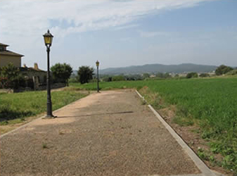 A walk way with light posts.