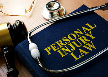 Personal Injury Law concept, Book and stethoscope