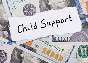 Child Support Note Placed On Top Of Dollar