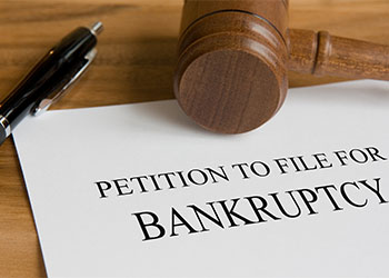 Petition to file for bankruptcy written on paper