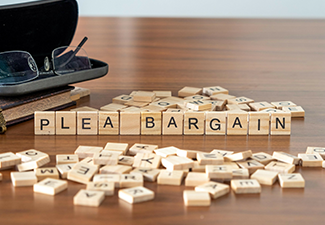 Plea Bargain Word Represented by Wooden Letter Tiles