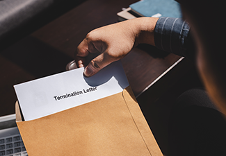 Person Receiving Termination of Employment Form in Paper Brown Envelope