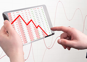 Falling stock market on tablet screen