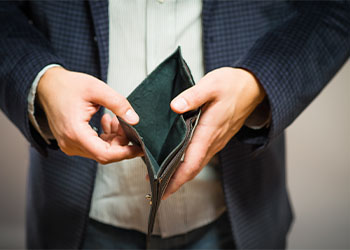 Bankruptcy - Business Person holding an empty wallet