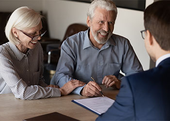 Old Couple Reviewing Estate Plan with Attorney