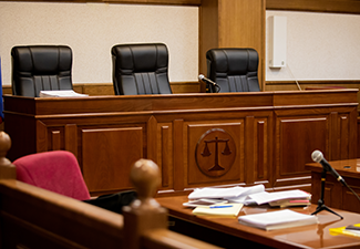 A courtroom in a Russian court, an empty judge's chair