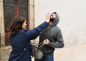 Angry woman defending herself from a thief