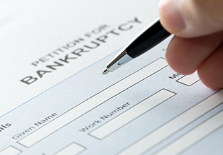 A Person Filling Bankruptcy Form