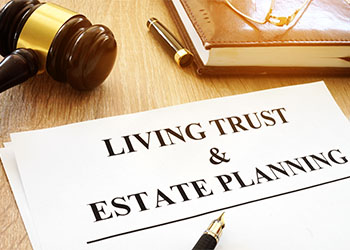 Living trust and estate planning form on a desk next to gavel