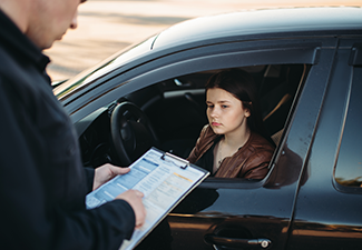 Policeman in Uniform Writes Fine to Female Driver