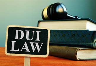 DUI law driving under the influence sign and books