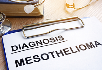 Diagnosis Mesothelioma and Stethoscope on A Desk