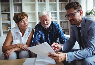 Senior Couple Planning Their Wills with Lawyer