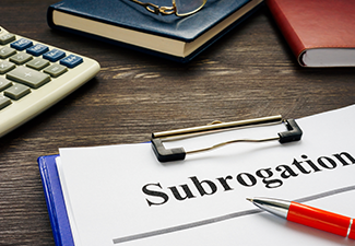 Documents About Subrogation with Notepad and Glasses