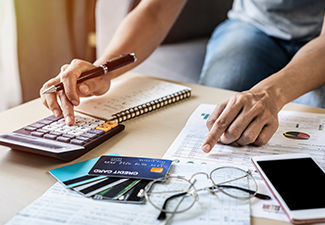 Young Woman Checking Bills, Taxes, Bank Account Balance