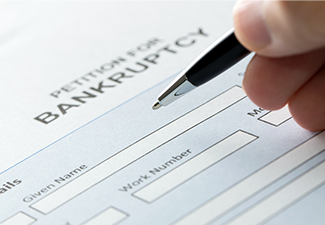 A Man Filling Bankruptcy Petition Form