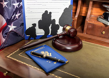 Gavel, passport and Silhouette of immigrants on wooden table