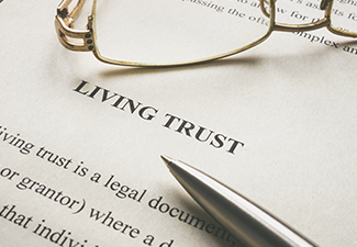 Document About Living Trust and Glasses on It