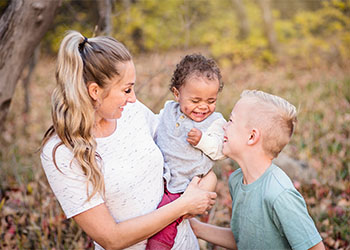 Happy blended family with adopted new kid