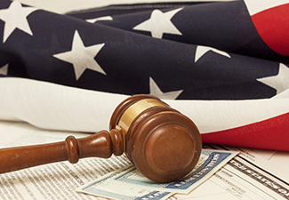 US flag and gavel on table