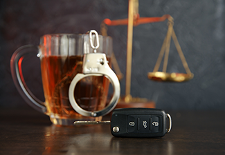 Law Hammer, Alcohol and Car Keys on Wooden Table