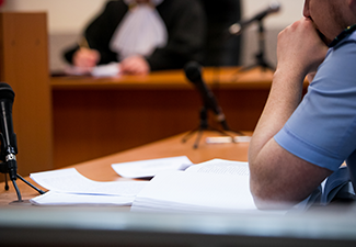 Lawyers listening to the judge in the court room