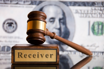 receiver gavel dollar bill