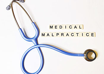 Medical Malpractice word and Stethoscope