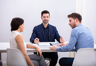 Disputed Couple Sitting In Front Of Judge